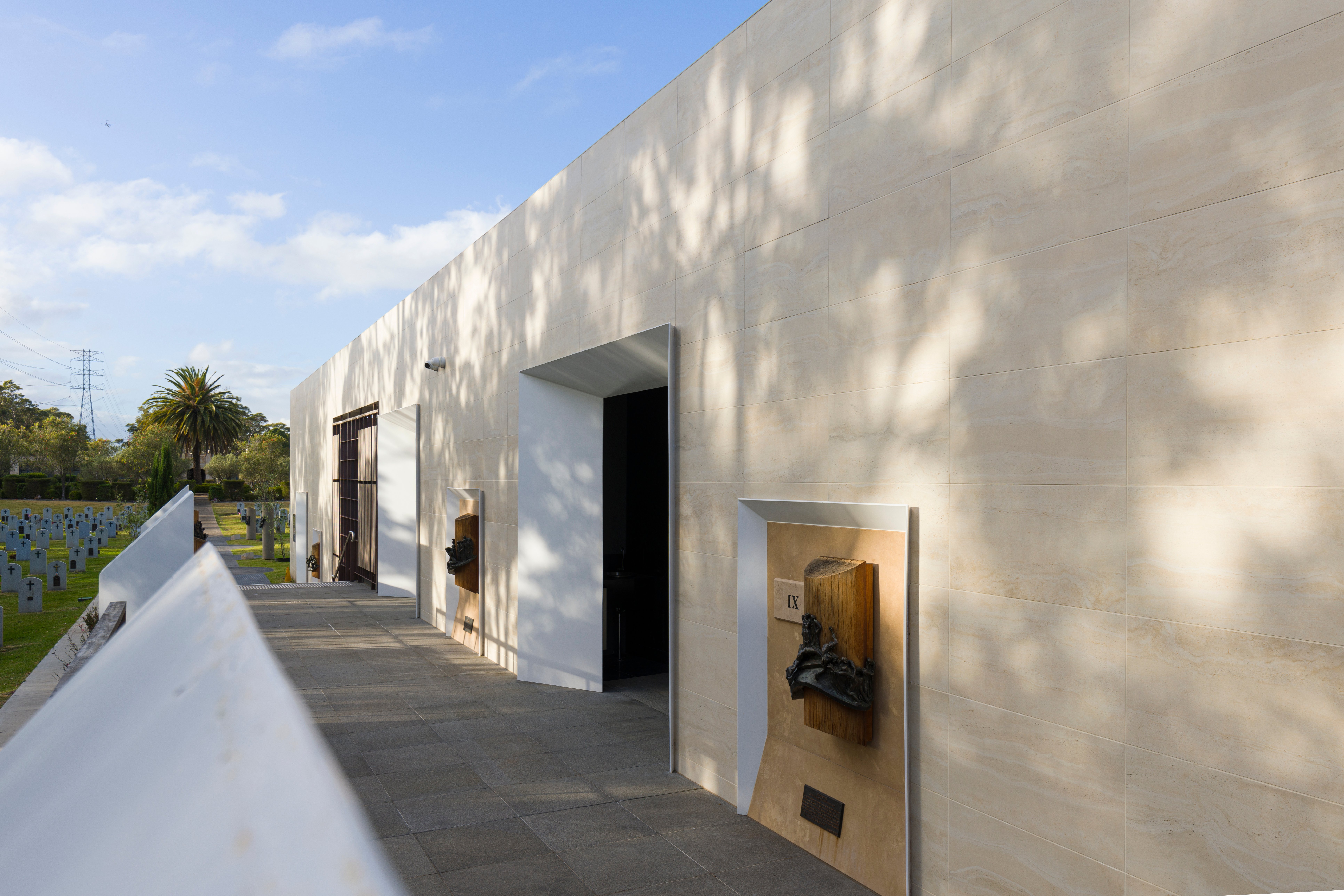 Beautiful white stone walls with the afternoon sun reflecting on it. The Mausoleum of the Holy Way at Macquarie Park Cemetery.
